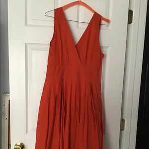 Sleeveless burnt orange v-neck/v-back dress